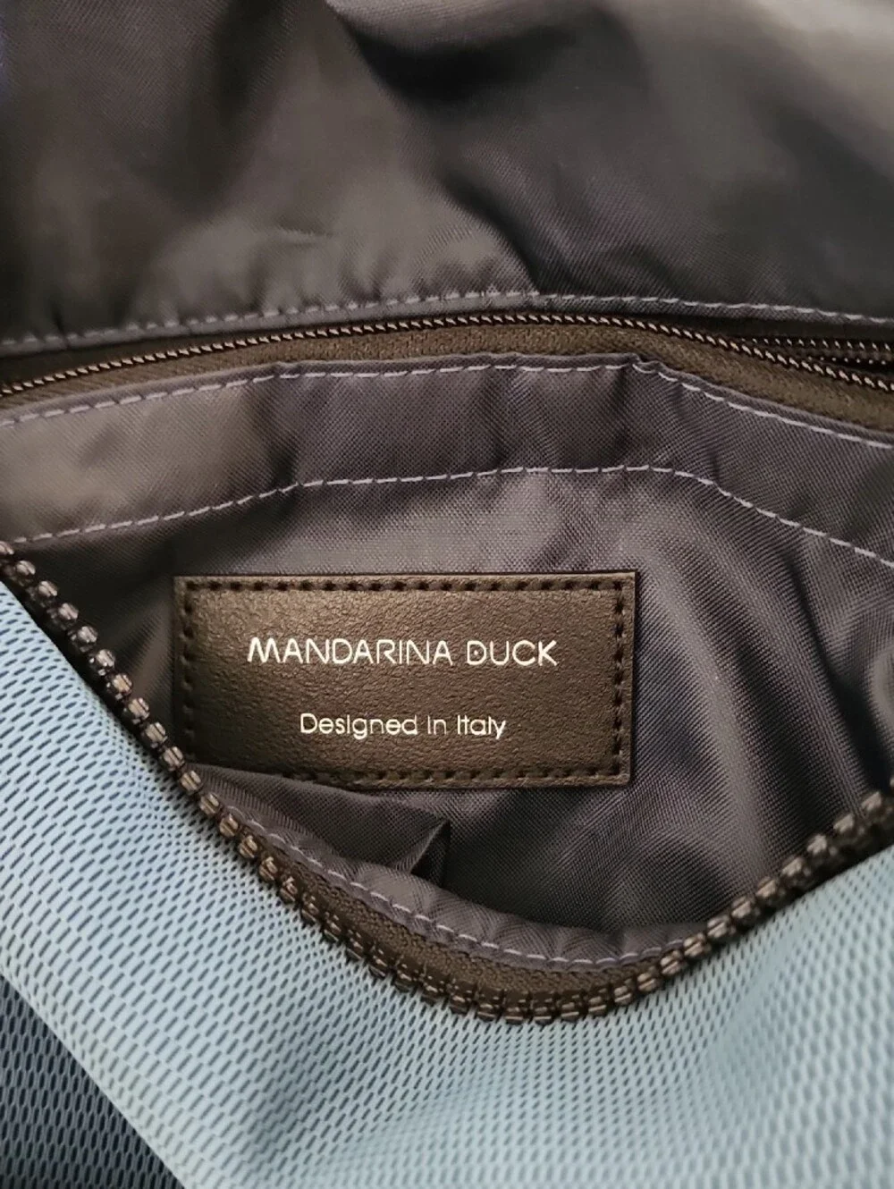 Mandarina Duck Blue Crossbody Backpack with Black Front Pocket